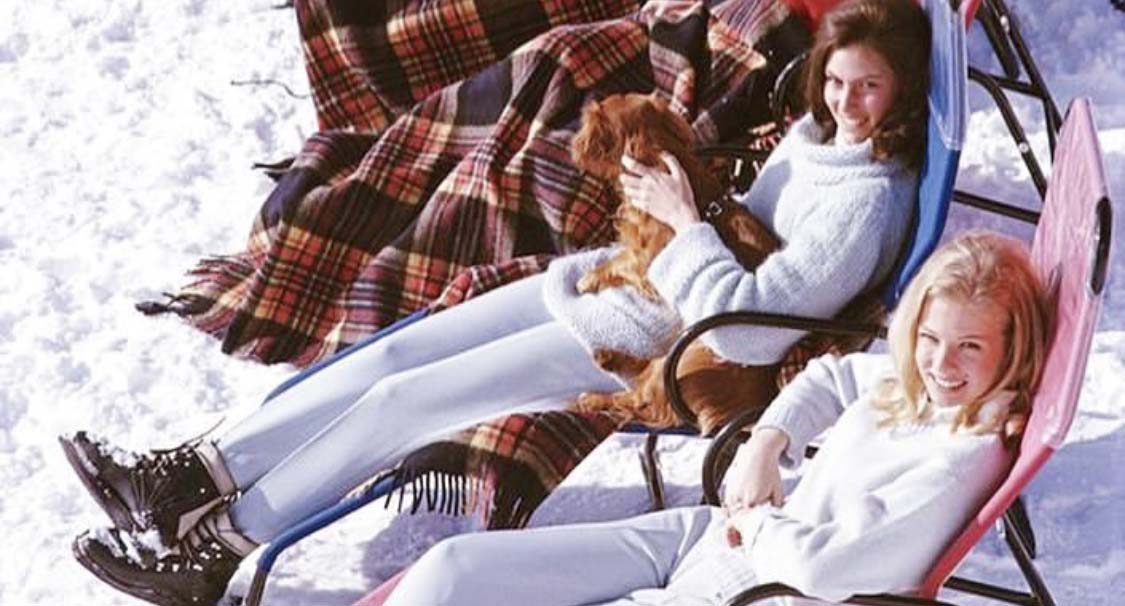 Women relaxing on the snow